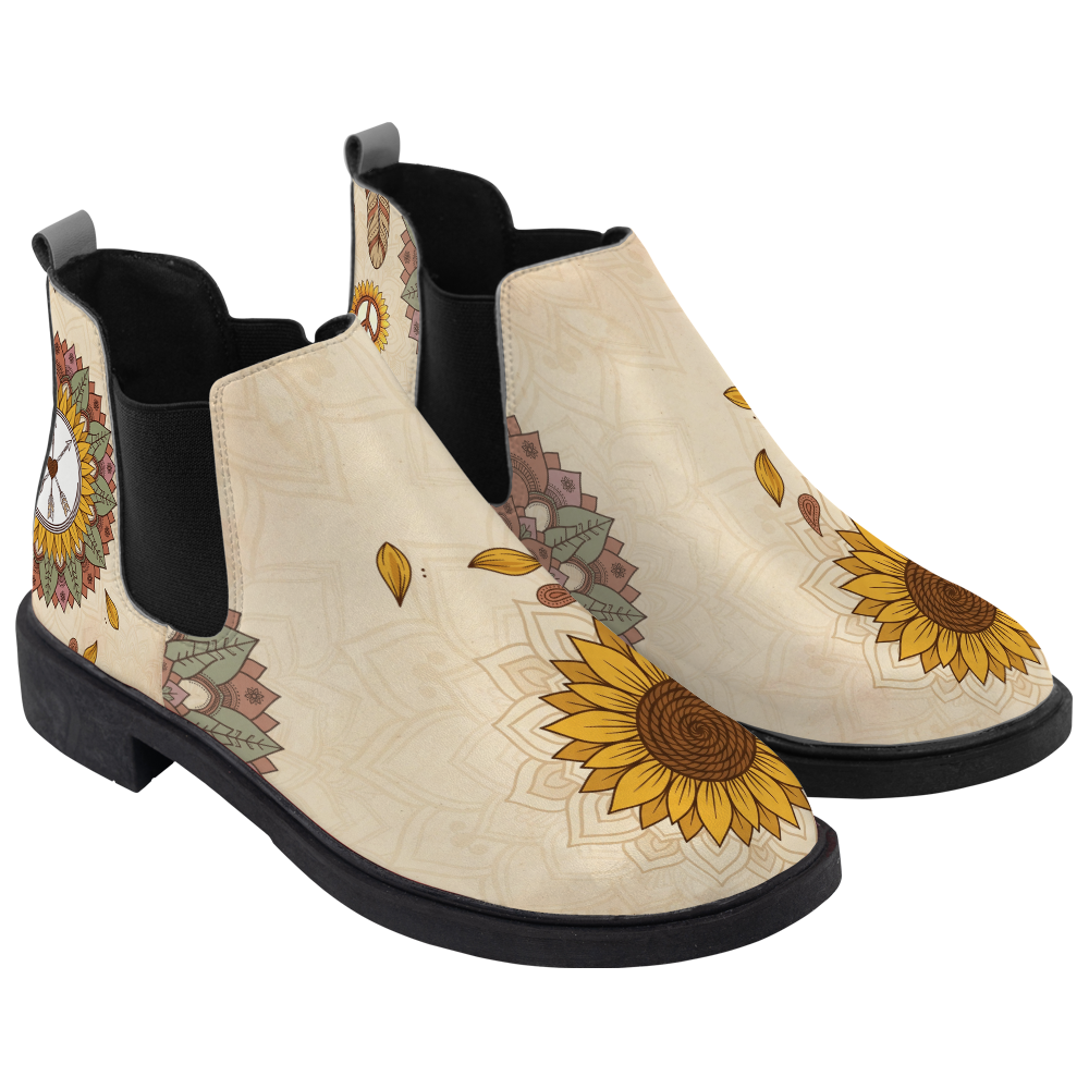 Joni Chelsea Boots, pair in three-quarter view, warm cream with a sunflower toe and peace sign, white background