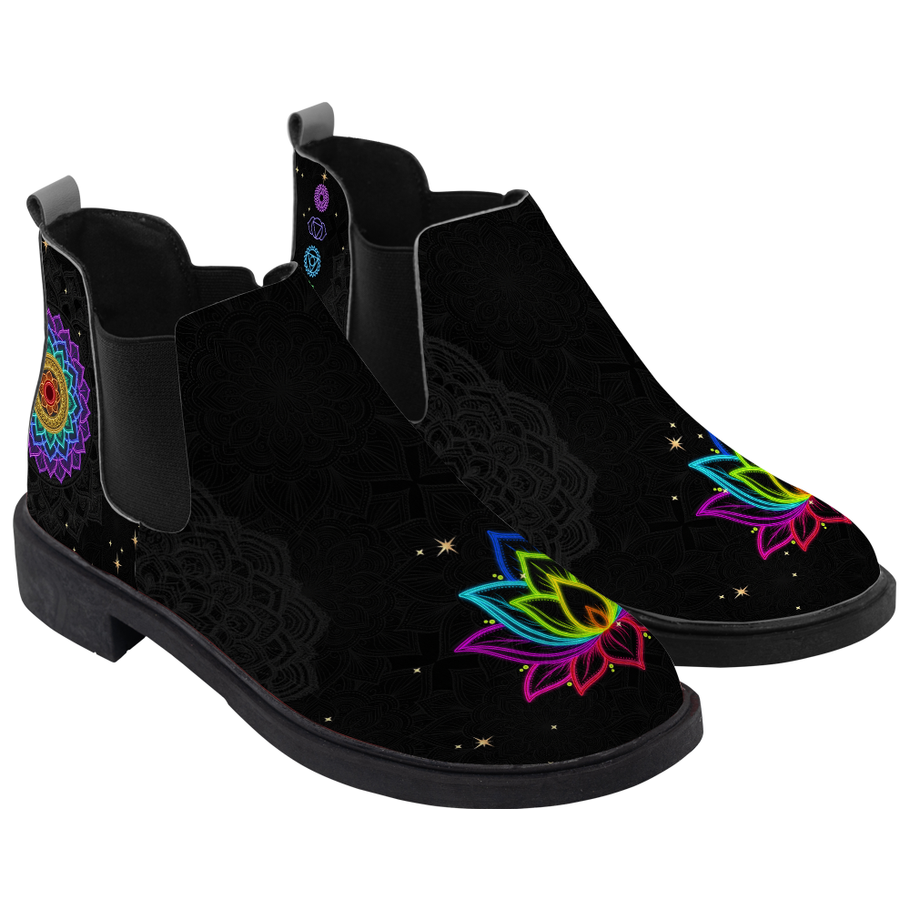 Iris Chelsea Boots, pair in three-quarter view, black with a rainbow lotus toe and chakra column, white background