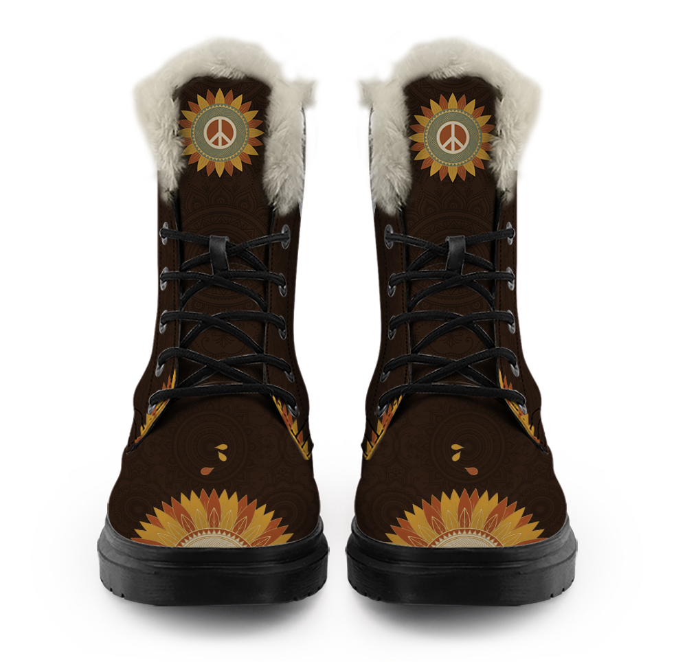 Sunny Winter Boots mockup - straight-on front view of the pair, a cream plush trim ringing each collar, a little peace-sign sunflower on each tongue where the trim ends, black laces down five open eyelets, half a gold and rust sunflower rising over each round toe on chocolate brown with a tone-on-tone mandala
