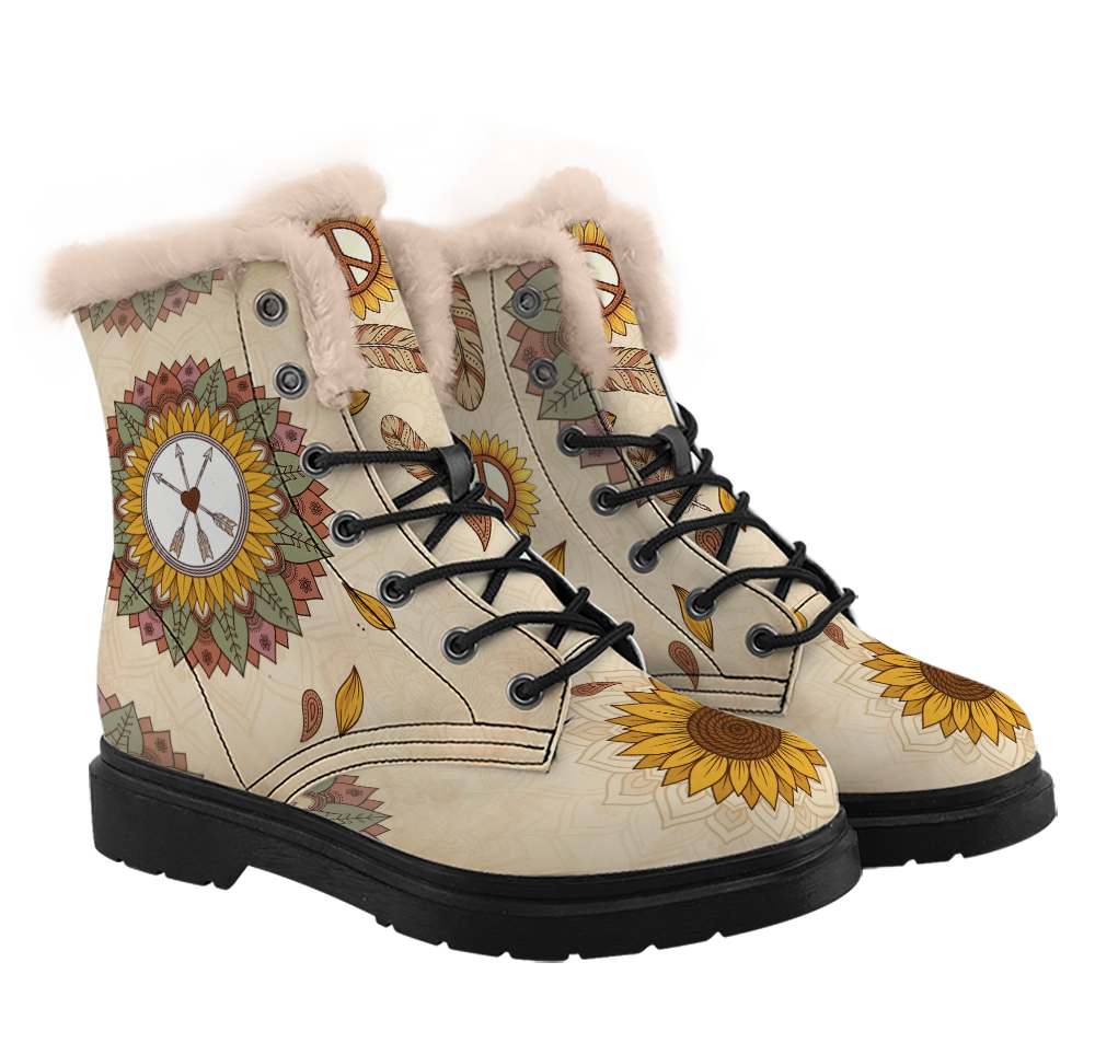 Joni Winter Boots mockup - cream lace-up pair from a three-quarter angle, thick pale plush collars, a sunflower medallion with three arrows and a heart on the side of one shaft, a peace-sign sunflower and striped feathers at the tongue, a gold sunflower across each toe, black laces, and a square close-up of the toe sunflower in the corner.