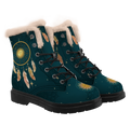 Willow Winter Boots mockup - pair in three-quarter view, cream plush piled round each collar, a gold dreamcatcher on the shaft with a lowered-lid sun face in its web and feathers hanging beneath it, feathers dropping from under the trim, a small gold sun on each toe, black laces, deep teal with tone-on-tone mandalas and gold stars