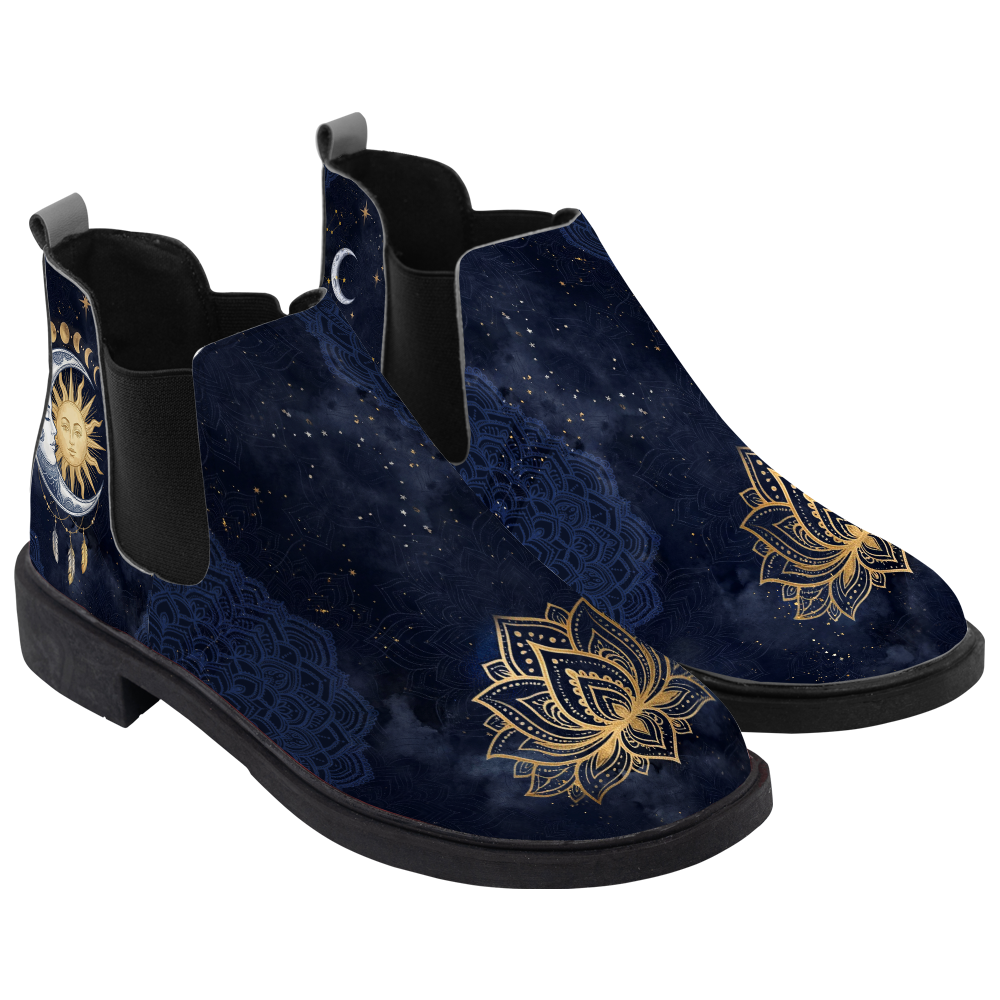 Celeste Chelsea Boots, pair in three-quarter view, midnight navy sky with a gold lotus toe, white background