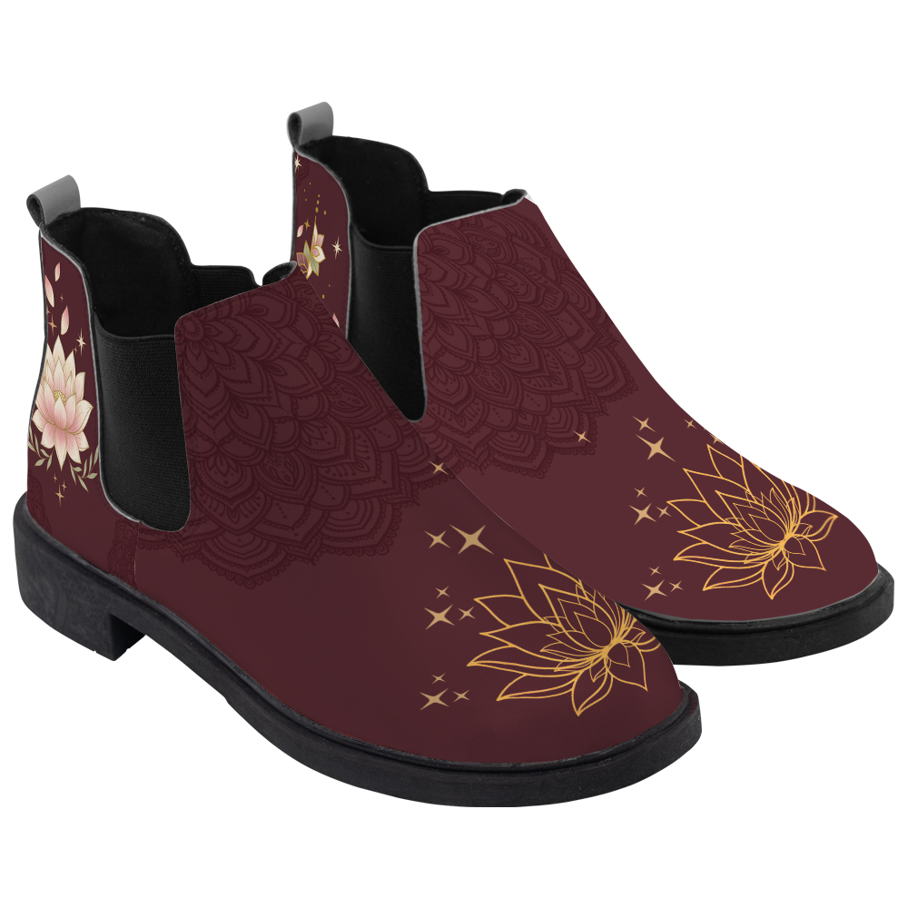 Lotus Chelsea Boots, pair in three-quarter view, deep wine with a gold lotus toe and unalome, white background