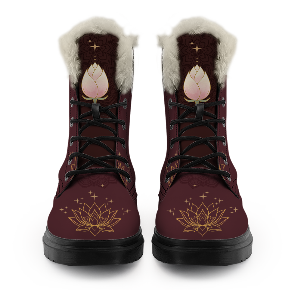Lotus Winter Boots mockup - a pair seen straight on from the front. Cream pile trim rounds each collar, a closed cream and blush lotus bud with a sage stem sits on each tongue over a darker mandala, black laces cross the front, and a gold line lotus ringed with sparks spreads across each round toe.