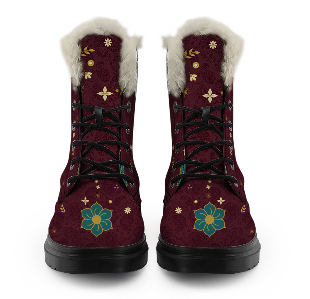 Paisley Winter Boots mockup - pair straight on from the front, off-white plush collars over the top of each shaft, cream daisies, gold leaf sprays and a cream four-petal flower under the collar, black laces through five open eyelets on each boot, a six-petal teal flower with a gold centre on each toe, deep wine with tone-on-tone paisley vines
