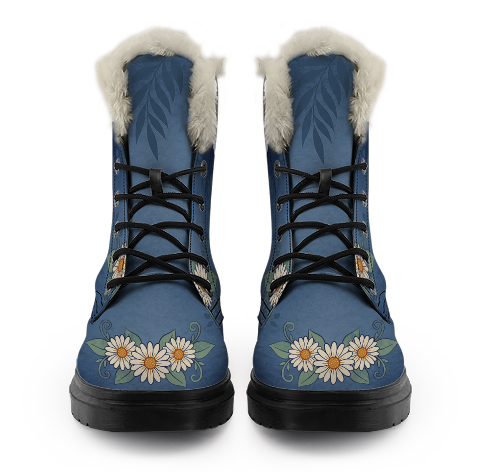 Daisy Winter Boots mockup - straight-on front view of the pair, off-white plush trim rolled over each collar, fern fronds printed a little darker than the washed denim blue and running down from the trim, black laces crossing five open eyelets a side, and a row of cream-white daisies with amber middles across each toe.