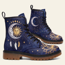 Navy boots printed with a sun and crescent moon face, moon phases and a gold lotus across the toe