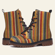 Boots printed with vertical serape stripes in rust, gold, olive and slate blue