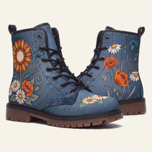 Denim blue boots printed with a sunflower, red poppies, white daisies and cornflowers