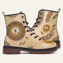Cream boots with a sunflower mandala around a peace sign, drawn feathers and falling leaves