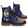 Celeste Leather Boots — pair shown from both sides on a white background, celestial sun & moon design in gold on navy