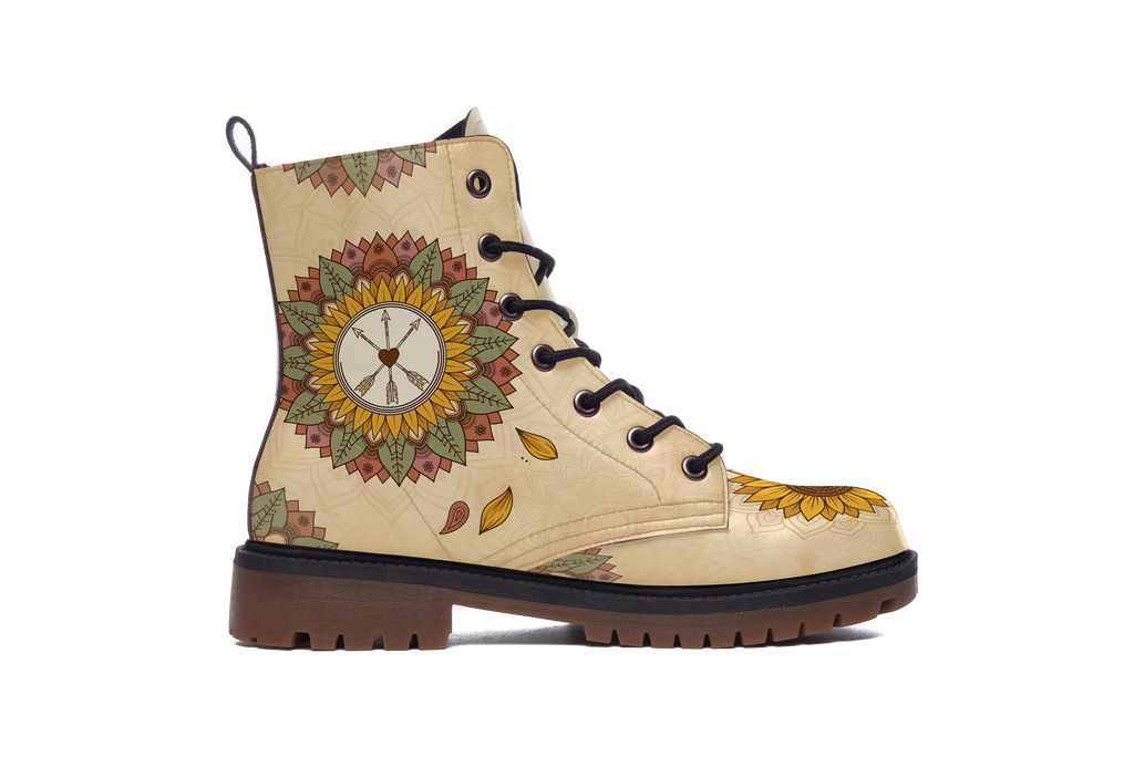 Joni Leather Boots outer side of the left boot: earthy sunflower medallion with arrows and feathers on cream leather, sunflower toe, white background