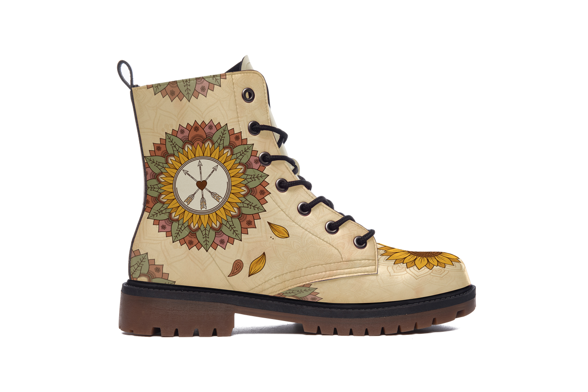 Joni Leather Boots outer side of the left boot: earthy sunflower medallion with arrows and feathers on cream leather, sunflower toe, white background