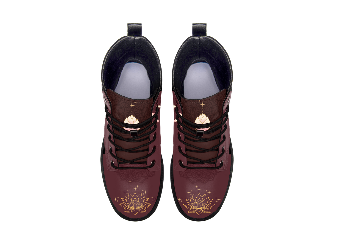 Lotus Leather Boots pair, top-down view showing the toe artwork, white background