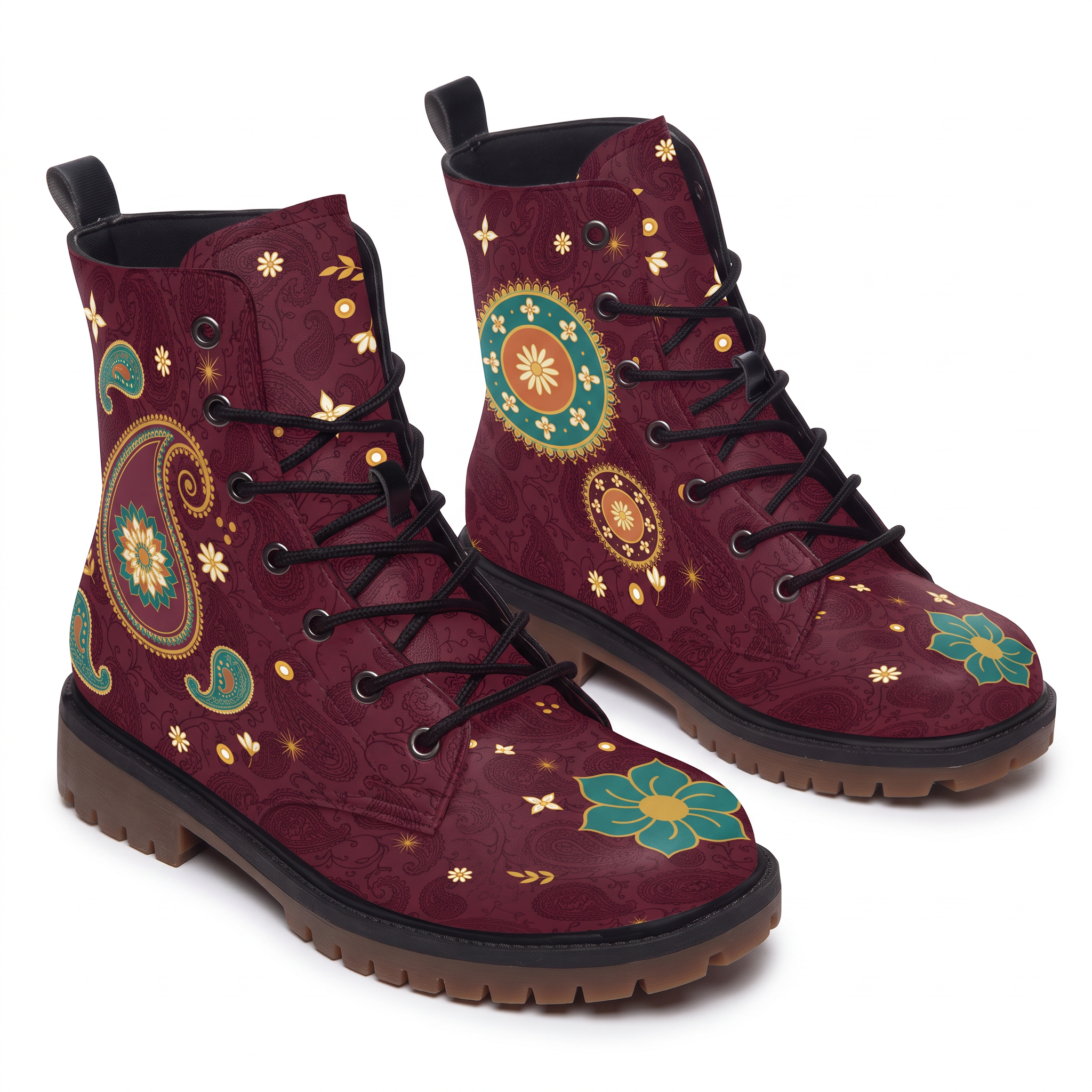 Paisley Leather Boots — a pair photographed on white showing both faces, one boot with a large gold-outlined boteh whose middle opens into a teal and cream rosette, the other with a round teal and orange medallion, deep burgundy upper