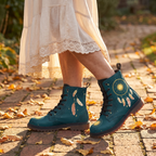 Willow Leather Boots — worn by a woman on an autumn brick path, gold dreamcatcher and blush feathers on deep teal