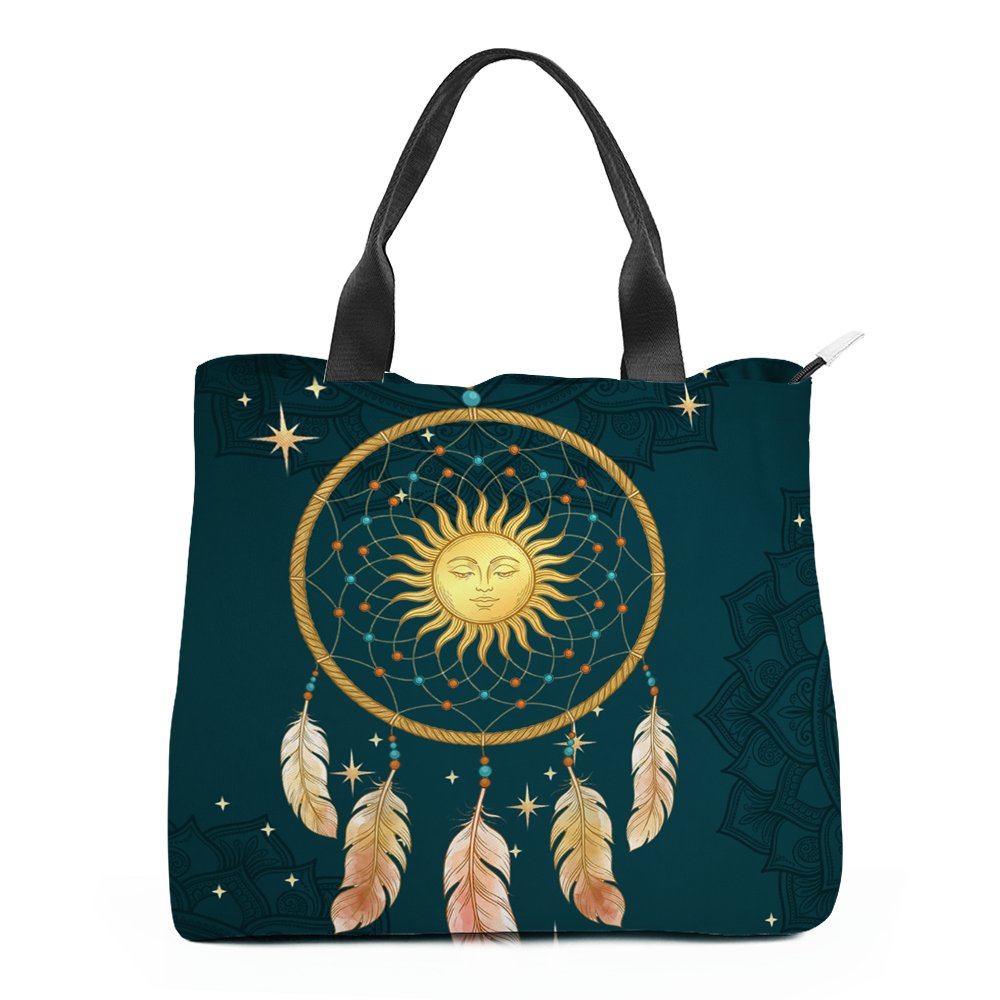 Willow tote bag front face: a gold rope hoop on deep teal holding a fine gold web strung with turquoise and rust beads, a gold sun face with lowered lids at its centre, and beaded feathers in pale gold and blush hanging below; tone-on-tone lace mandalas fill the ground and carry round the side panel, with black webbing handles above.