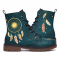 Willow Leather Boots — pair shown from both sides on a white background, gold dreamcatcher with a sleeping sun face on deep teal